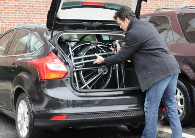 Montague Boston 8 folded into car trunk