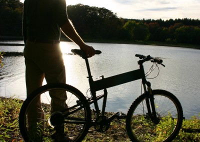 2015 Montague Paratrooper folding bike standing in front of lac