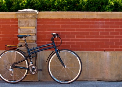 2015 Montague Navigator folding bike against red brick wall