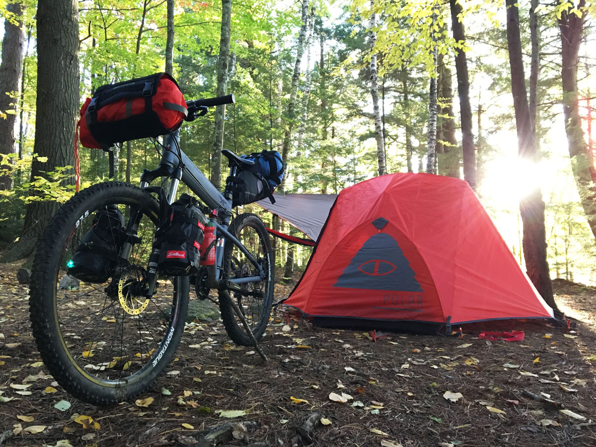 Montague Paratrooper Highline folding mountain bike with bikepacking gear and tent